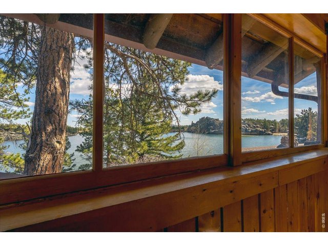 Property Photo 14 Dining area boasts windows on two sides, all overlooking your beautiful lake views!