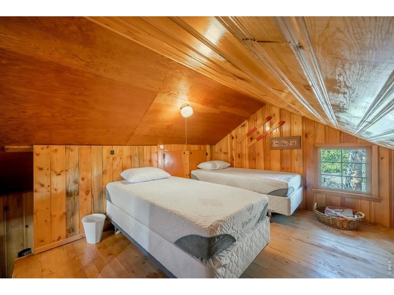 Upstairs in the main cabin offers a divided bedroom setup.
