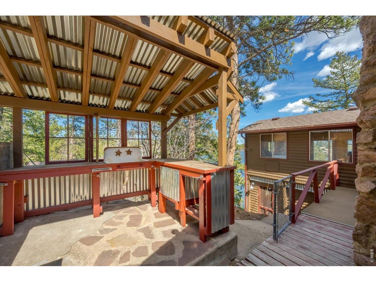 Covered food processing and outdoor grilling space is perfect for everyday cooking or entertaining at your mountain paradise!