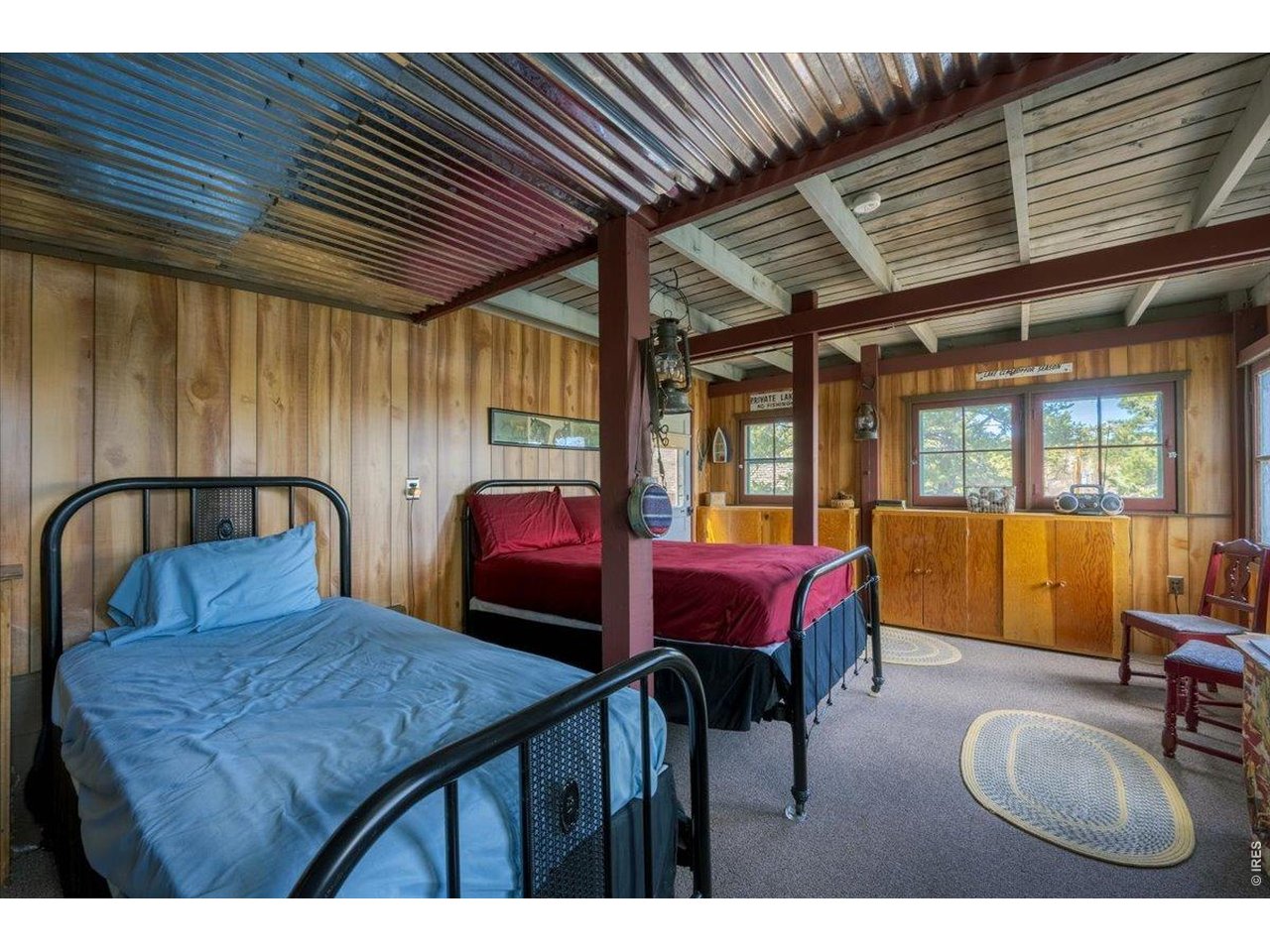 Downstairs in the detached building offers another unique guest house, sleeping area, or bonus room/lounge!