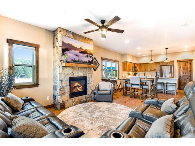 Property Photo 14 Gas fireplace with floor to ceiling stone.
