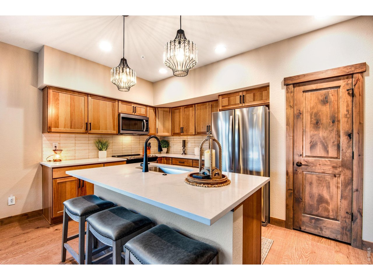 Quartz countertops and solid wood cabinets, trim and doors.