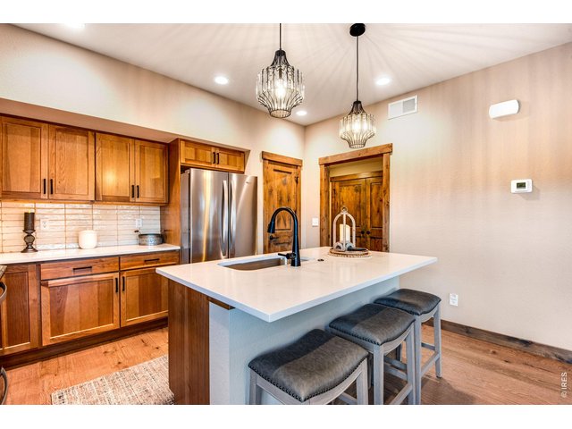 Property Photo 21 Custom light fixtures and soft close cabinets.