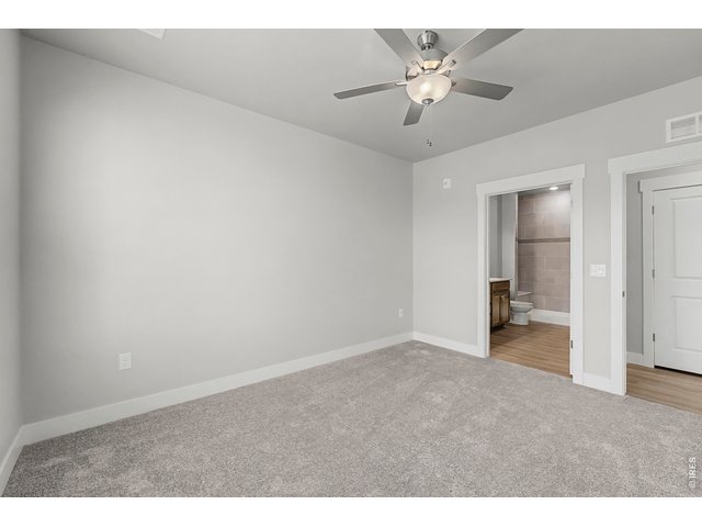 Property Photo 9 Primary bedroom w/ ceiling fan included! 