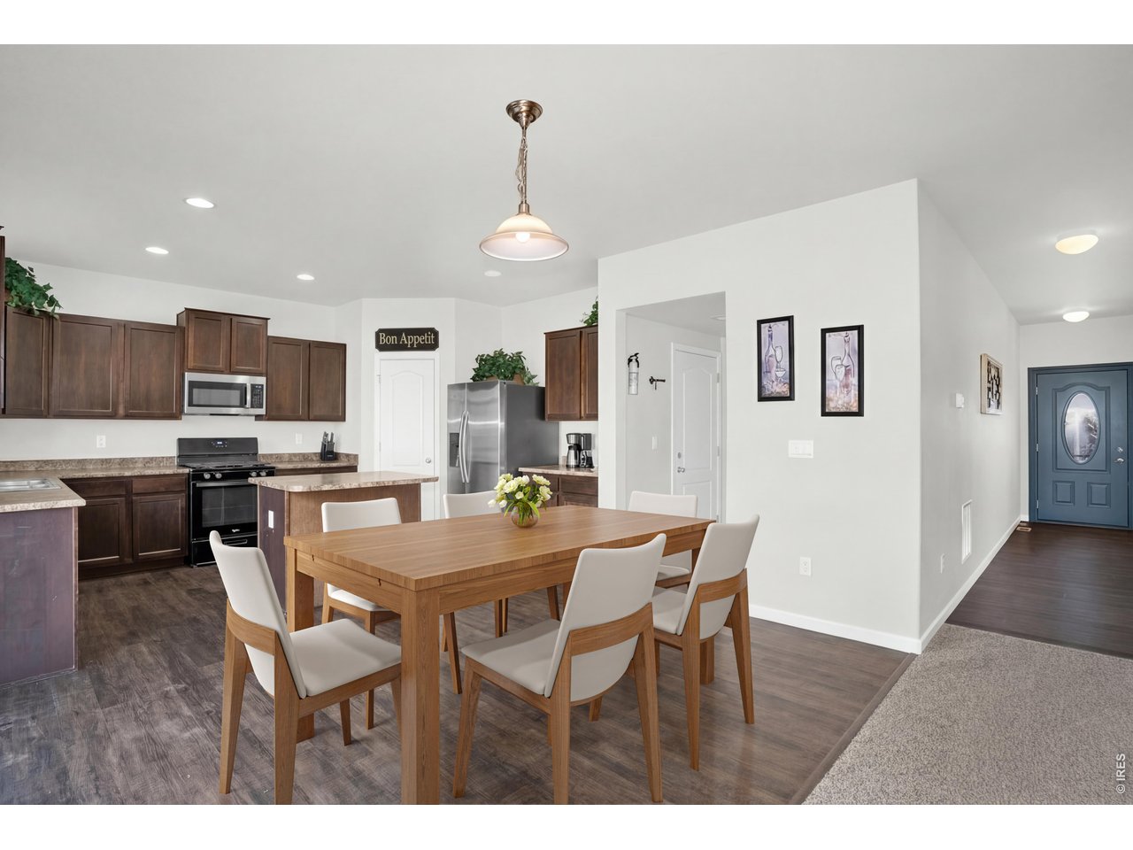 The eat-in kitchen is large enough to accommodate a large table and blends comfort and convenience, being only steps to the kitchen workspace and living room activities 
