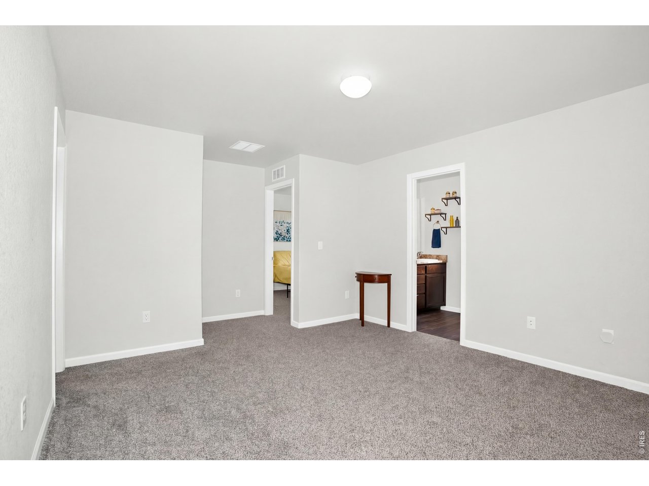 At the top of the stairs, you will find this loft area, which is the hub to all 4 upstairs bedrooms, laundry, and would be great for a second area for late-night movies, homework, hobby or play area! 