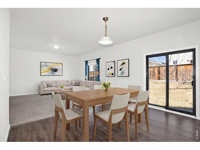 Property Photo 8 Sleek NEW black-framed windows and door are UV-protective, preserving interior finishes while allowing natural light to fill the home!