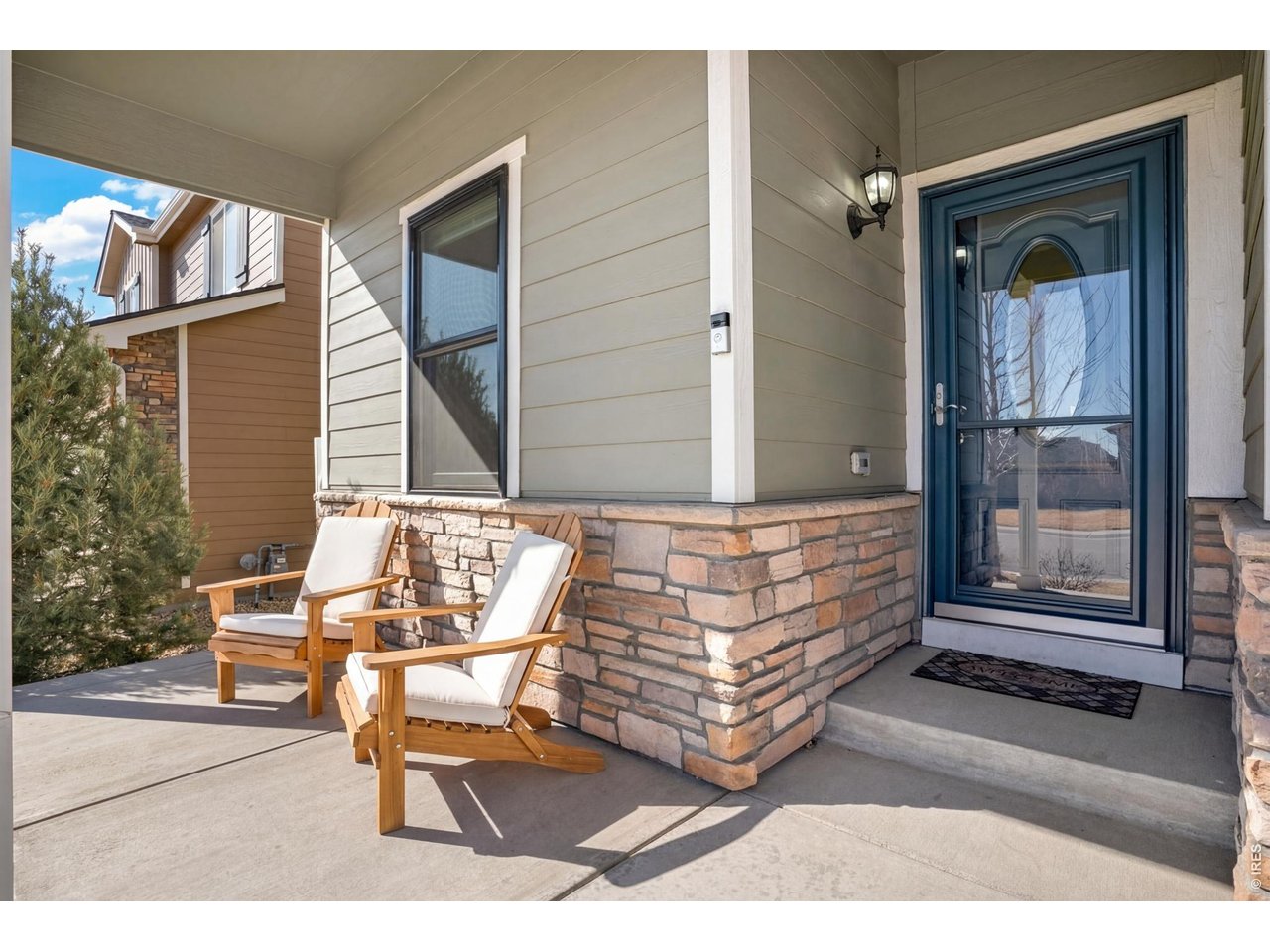 Sunny front porch invites you to slow down and stay awhile!! It's the perfect spot to enjoy morning coffee, greet your new neighbors, or unwind in the evening! 
