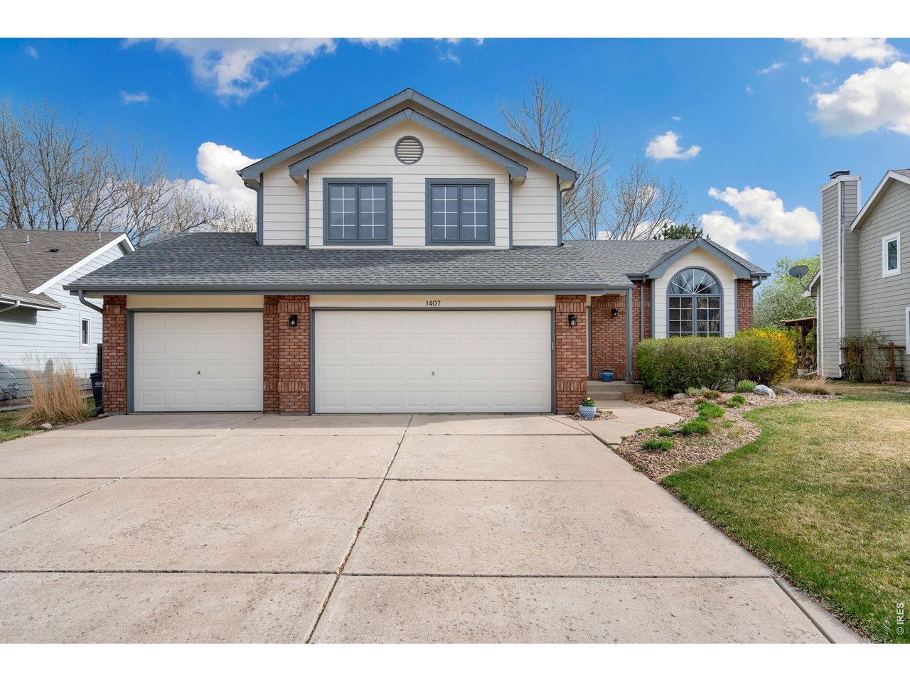 Front of home; three car garage. 
