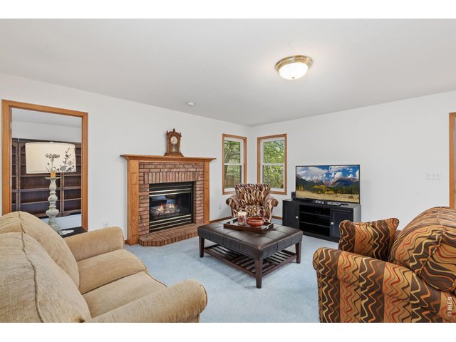 Property Photo 19 Family room and fireplace. 
