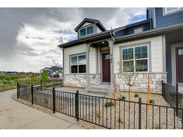 Property Photo 35 End unit with fenced in courtyard for pets, raised garden beds and a patio for relaxing! 