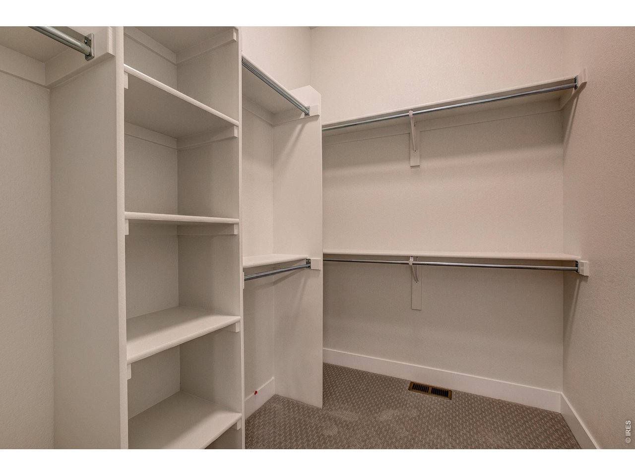 Property Photo 19 Primary walk-in closet 