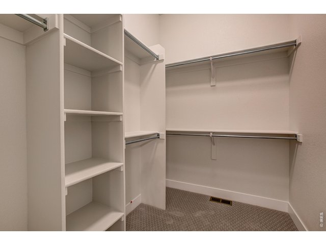 Property Photo 19 Primary walk-in closet 
