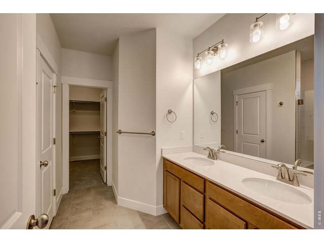 Property Photo 16 Primary bathroom with dual vanities