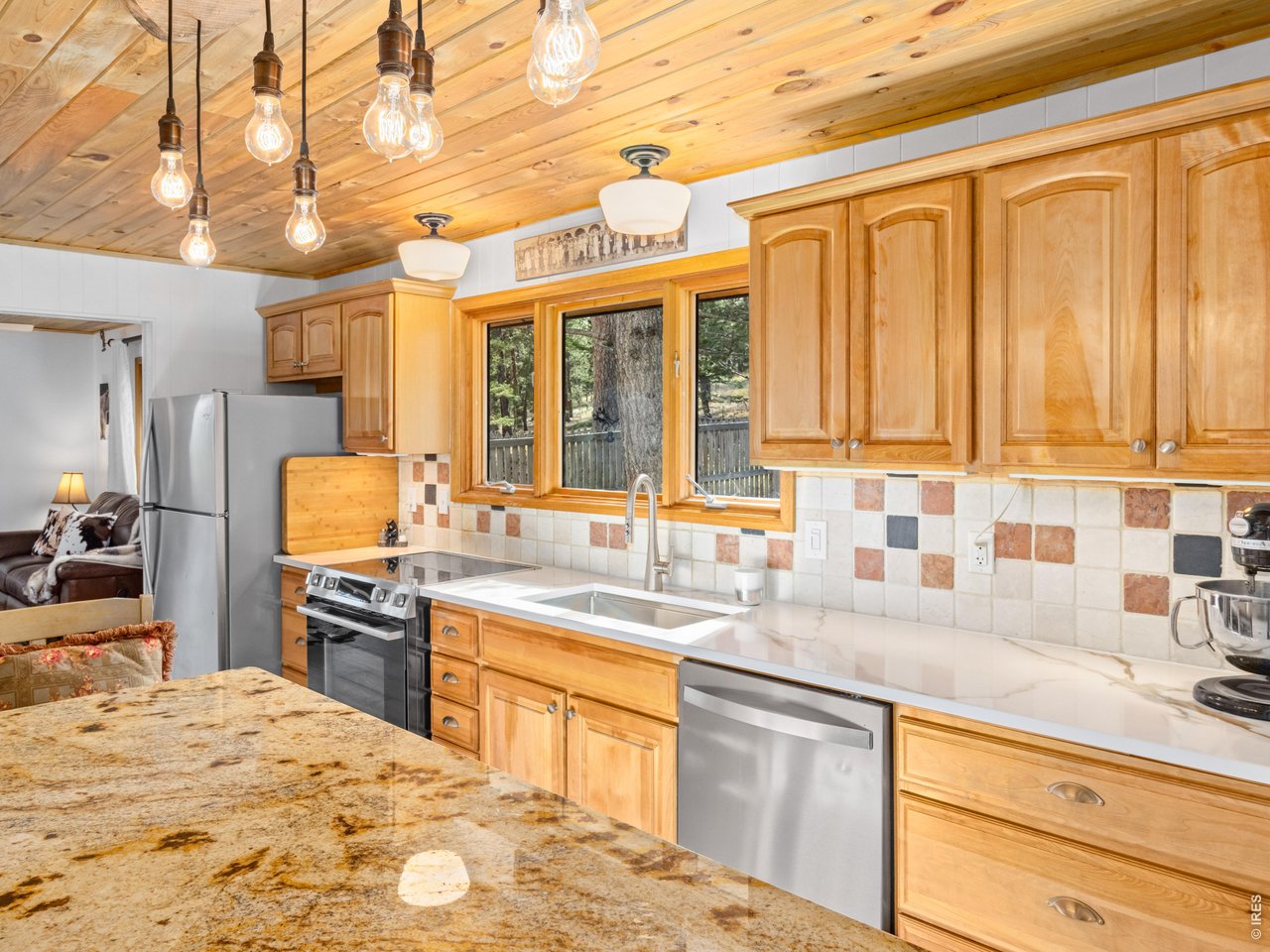 Custom kitchen of granite & stainless