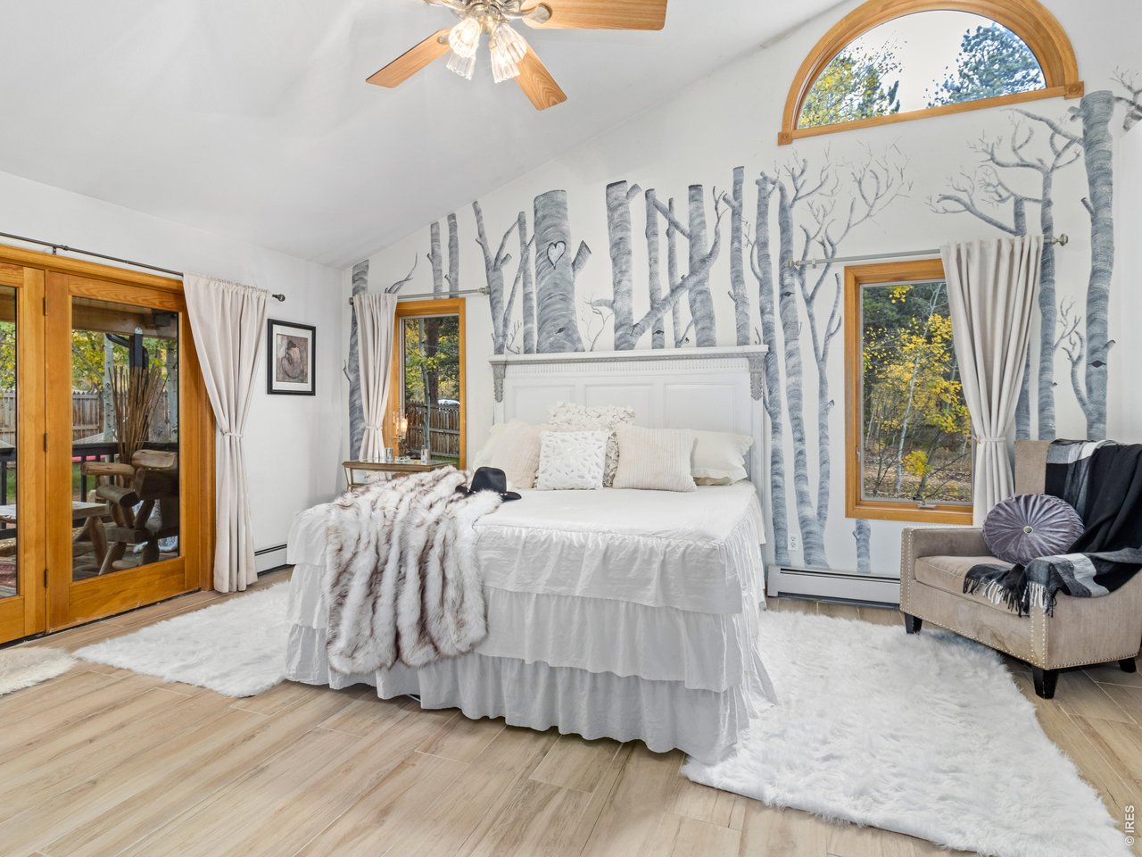 Private primary suite with french doors to the deck