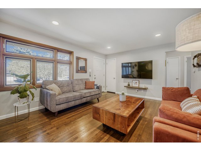Property Photo 7 Hardwood floors gleam and reflect the light
