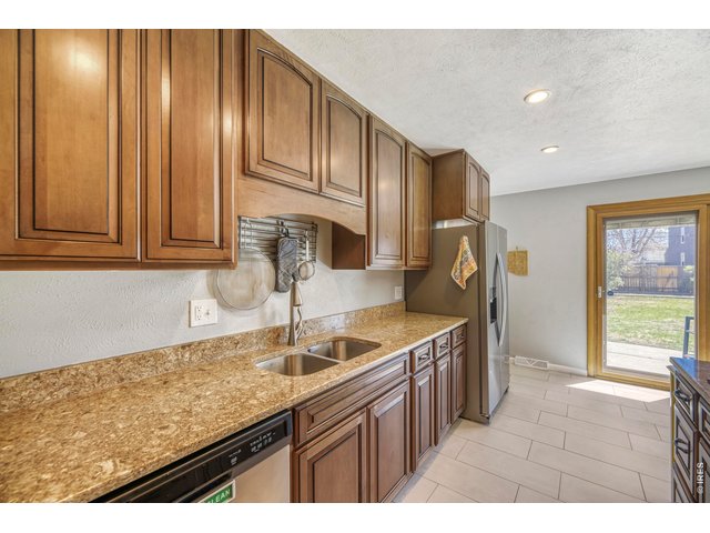 Property Photo 11 Solid surface countertops and plenty of cabinet space