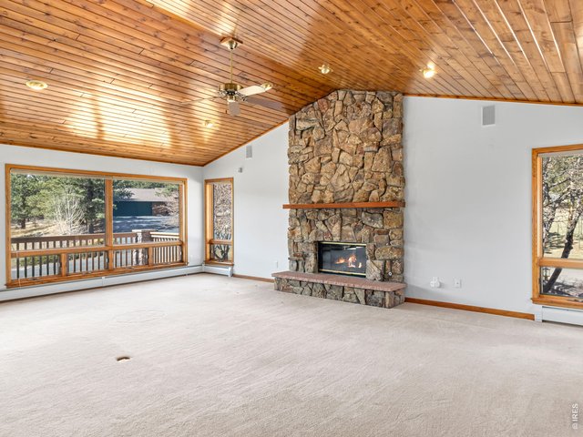 Property Photo 15 Great room with wood ceilings