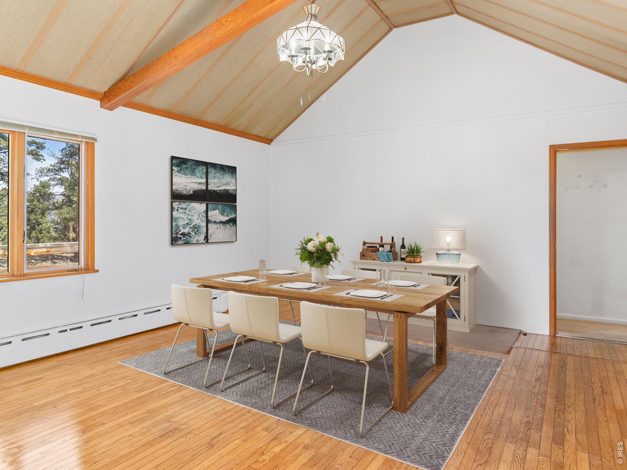 The adjoining dining space creates an inviting setting for gathering and relaxing