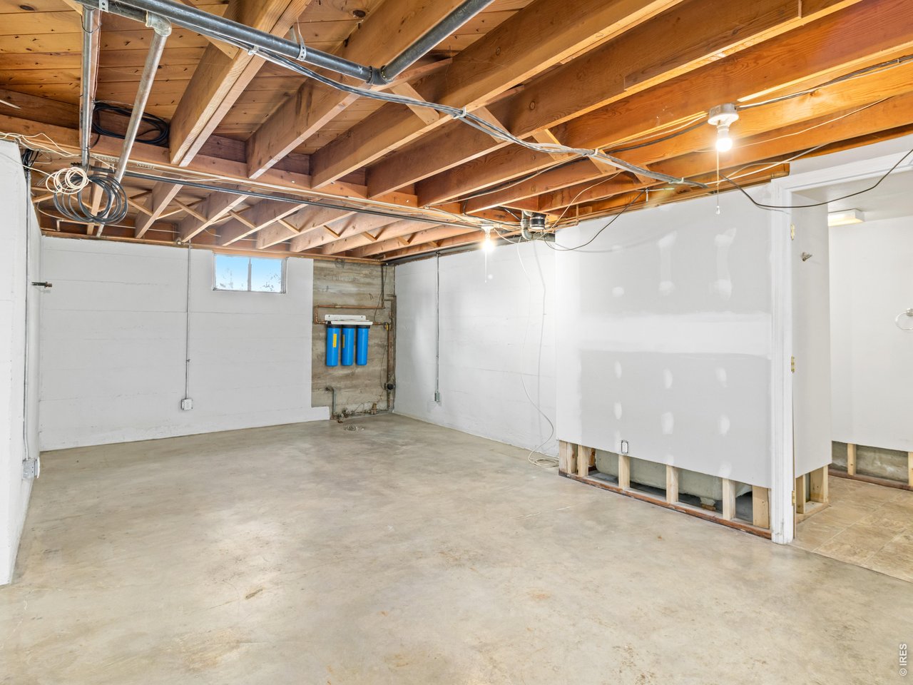 Downstairs, a three-quarter bath in need of some re assembly and a completely unfinished basement offer endless possibilities for expansion, storage, workshop space, or future customization