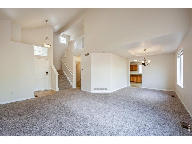 Property Photo 8 Open living room with attached dining 