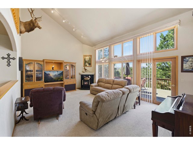 Property Photo 9 Vaulted Family Room with Floor to Ceiling Windows!