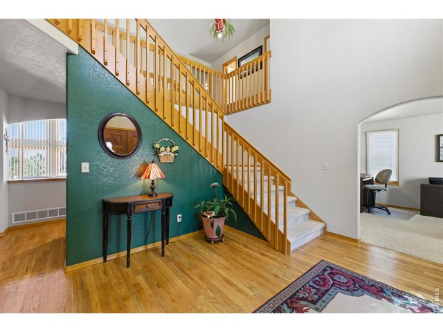 Property Photo 5 Beautiful real hardwood floors. To the right is a large size Office or can be a 4th Bedroom