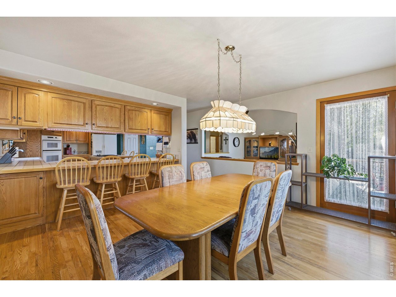 Spacious Seating both in the Dining Room and at the Breakfast Bar. Beautiful Wood Windows 