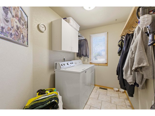 Property Photo 20 Main Floor Laundry Room with Tile Floors