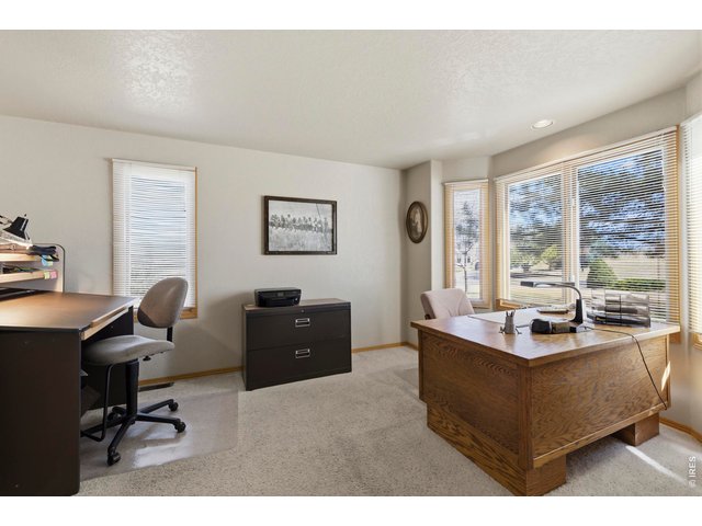 Property Photo 6 Large Main Floor Office with Bay Window and Closet. Could be a 4th Bedroom
