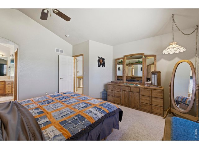 Property Photo 24 Primary Suite has a Vaulted Ceiling and Arch Doorway into the Spa Like Bathroom