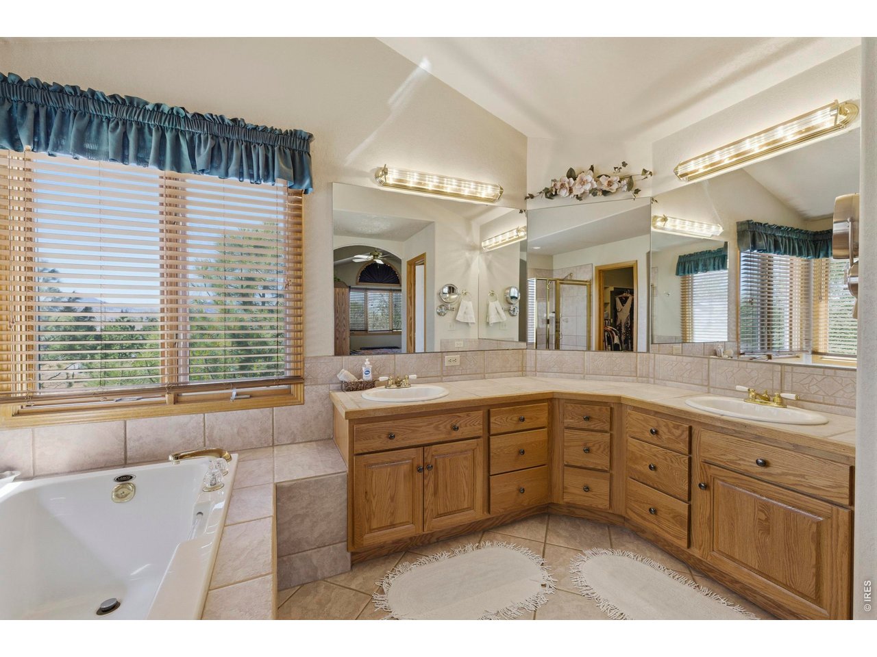 His and Her Sinks, Loads of Mirrors and Ample Lighting to prepare for your day