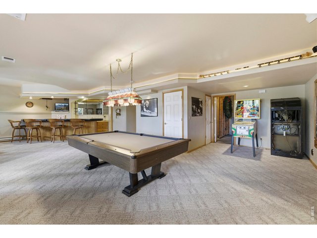 Property Photo 31 Large Built-In Wet Bar, Refrigerator, Microwave, Pool Stick Cabinet (Pool Table and Light Excluded)