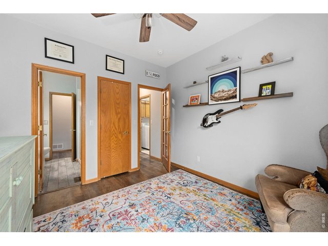 Property Photo 22 Main floor ensuite bedroom with 3/4 attached bath. Great for an office or multi-generational living