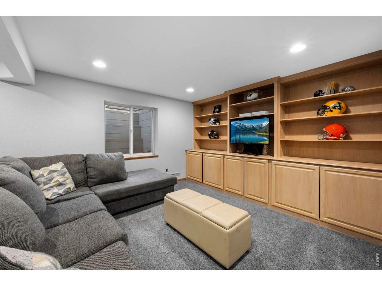 Large rec room in basement with lots of built-ins