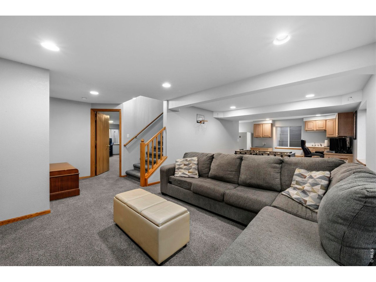 Large rec room in basement with lots of built-ins
