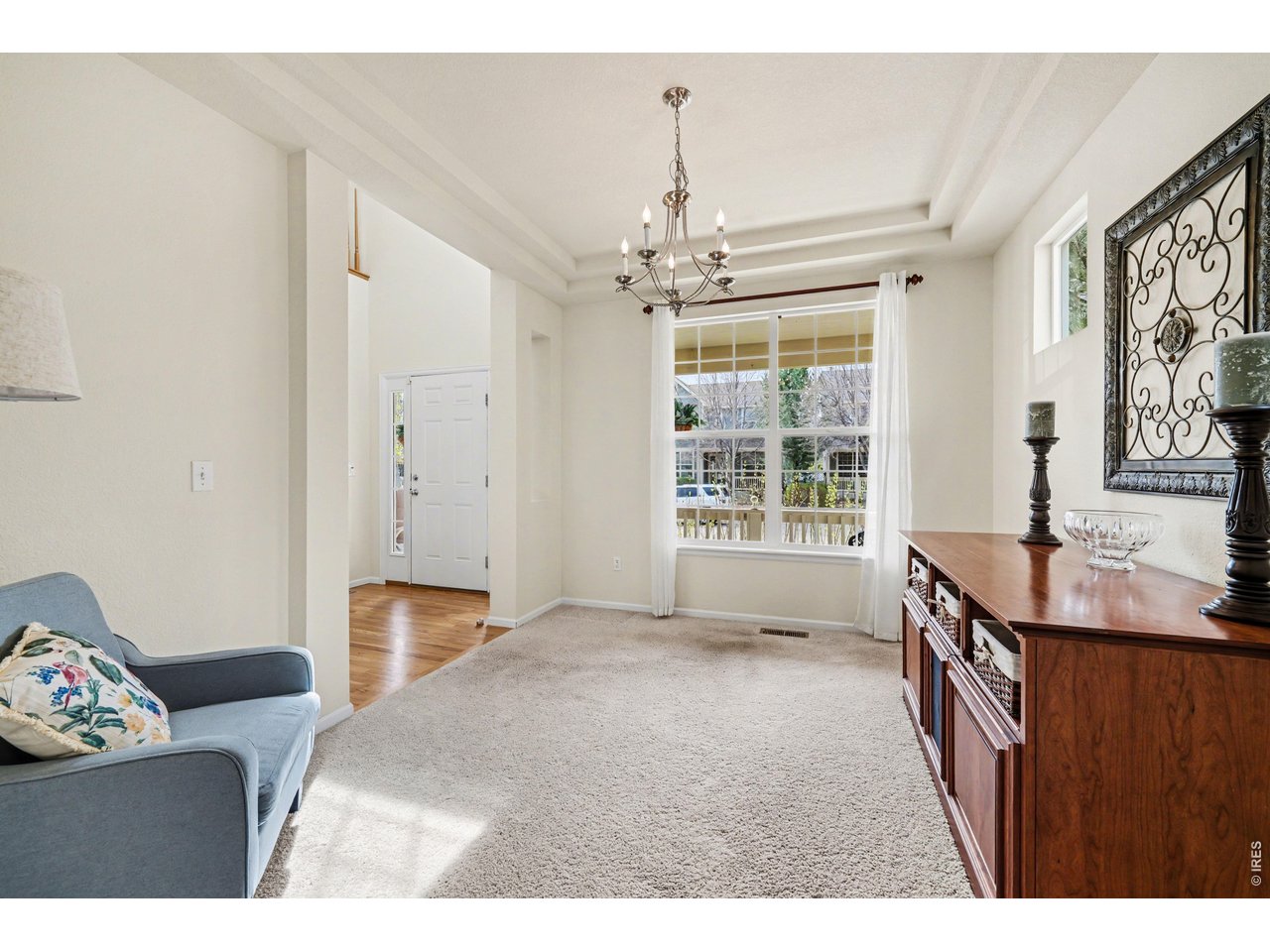 Living/Dining room elevated by elegant tray ceilings
