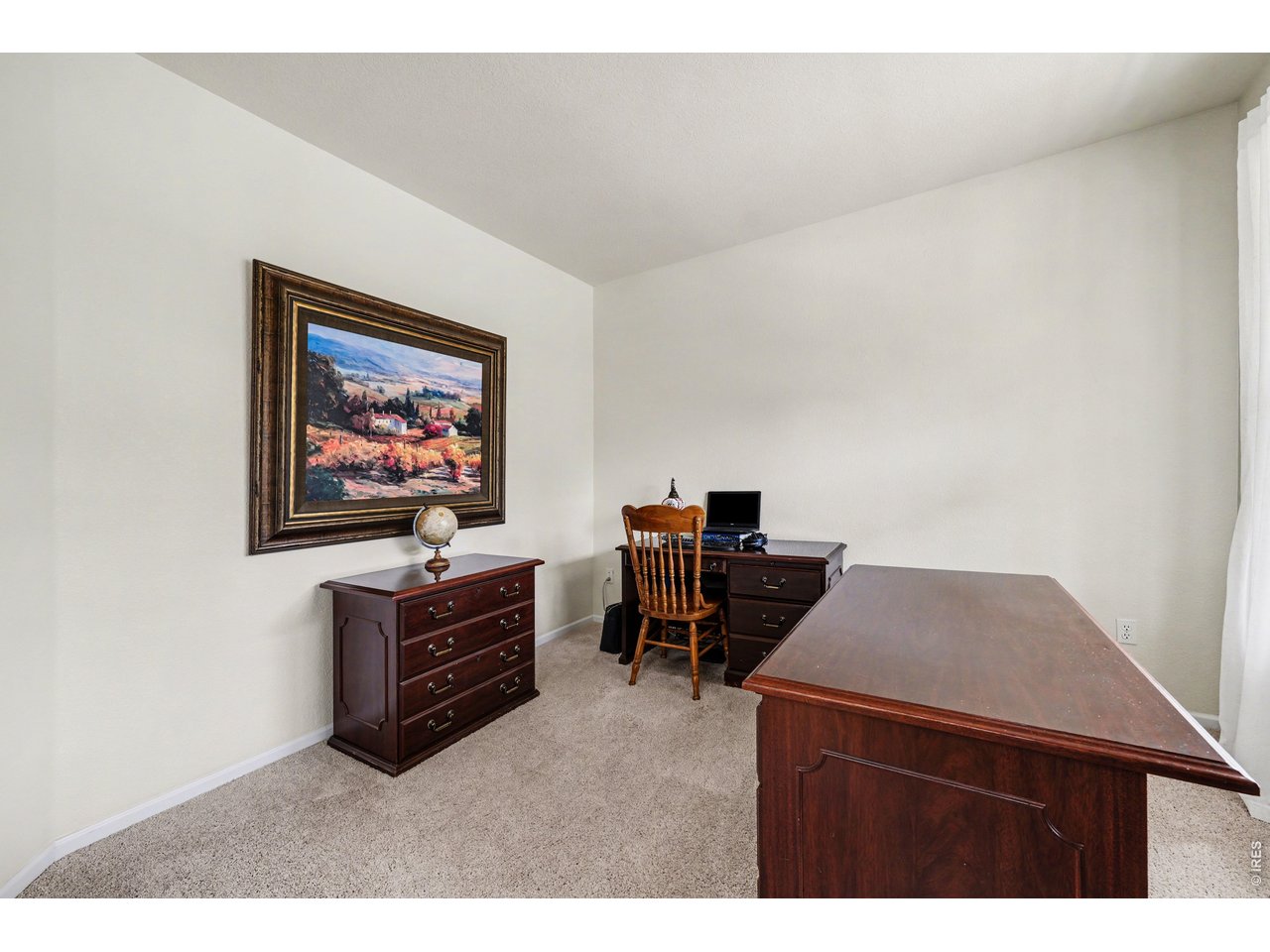 Quiet, dedicated main level workspace with plenty of room for productivity