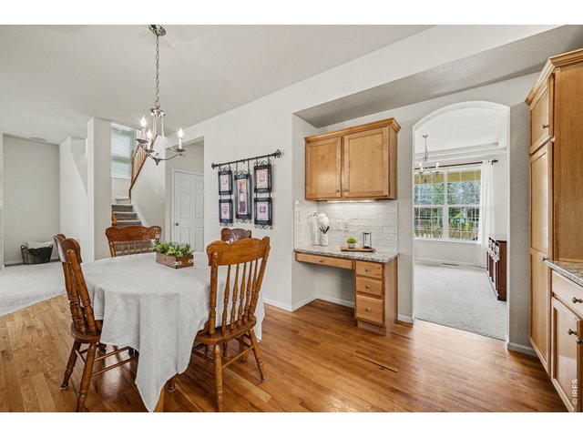 Property Photo 12 Versatile kitchen dining area with built-in desk and outdoor views