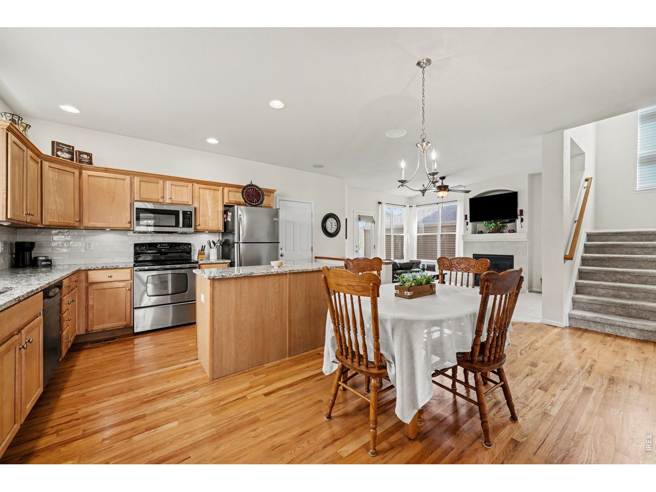 Open-concept kitchen and dining flow into a cozy living area