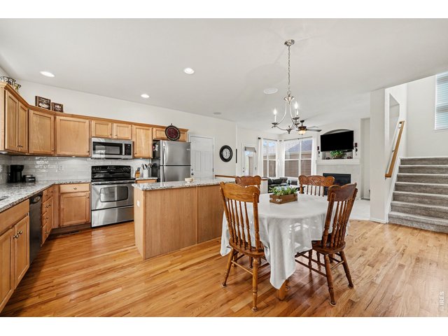 Property Photo 11 Open-concept kitchen and dining flow into a cozy living area