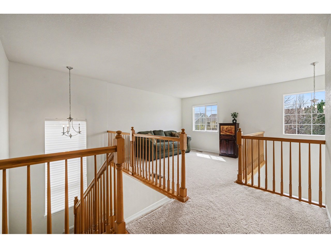 Versatile upper-level loft offering a cozy retreat or additional living space