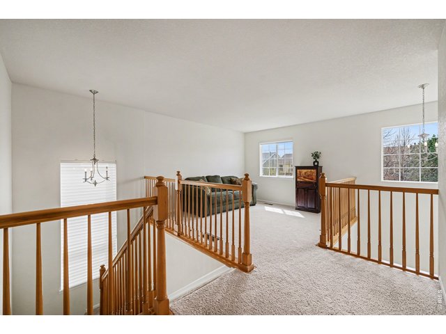 Property Photo 18 Versatile upper-level loft offering a cozy retreat or additional living space
