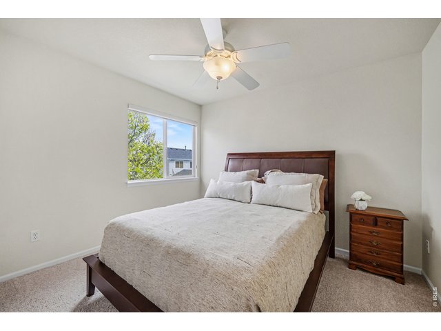 Property Photo 29 Cozy secondary bedroom with plenty of space for storage and relaxation