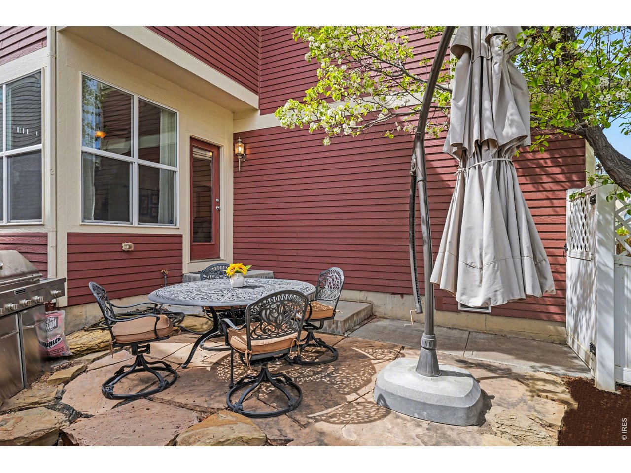 Expansive flagstone patio, perfect for outdoor dining, summer BBQs, and entertaining