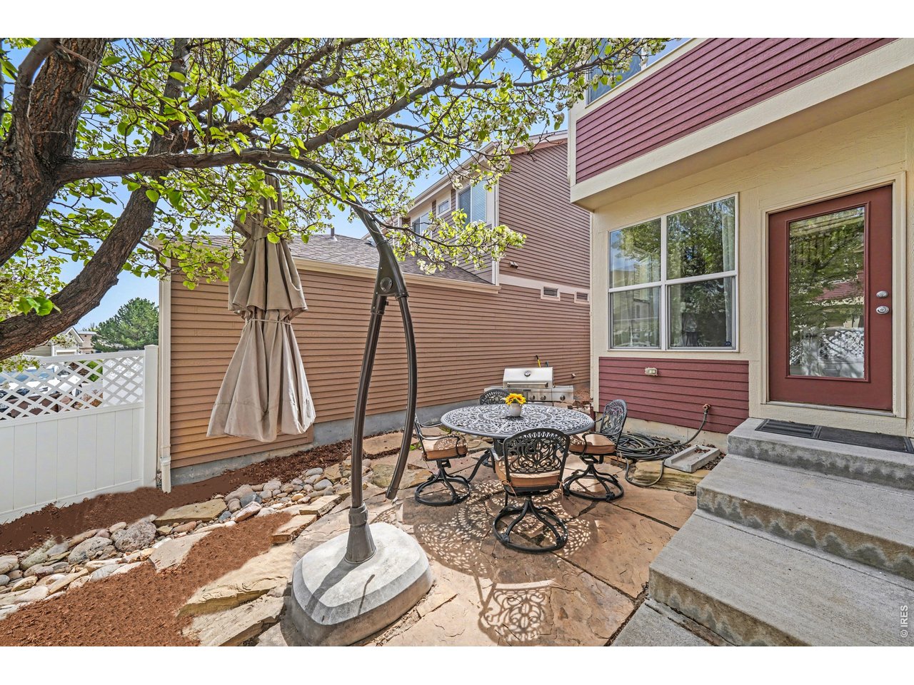Low-maintenance outdoor space with a spacious patio area, ideal for a fire pit or comfortable lounge seating