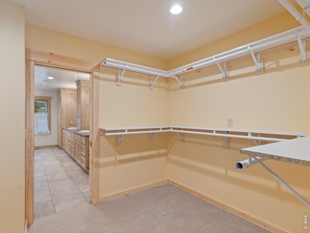 Property Photo 18 Walk in closet off primary bath