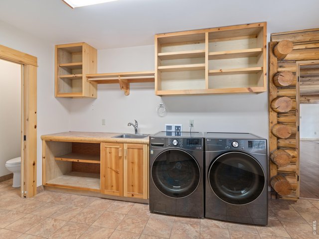 Property Photo 29 Large laundry room and half bath