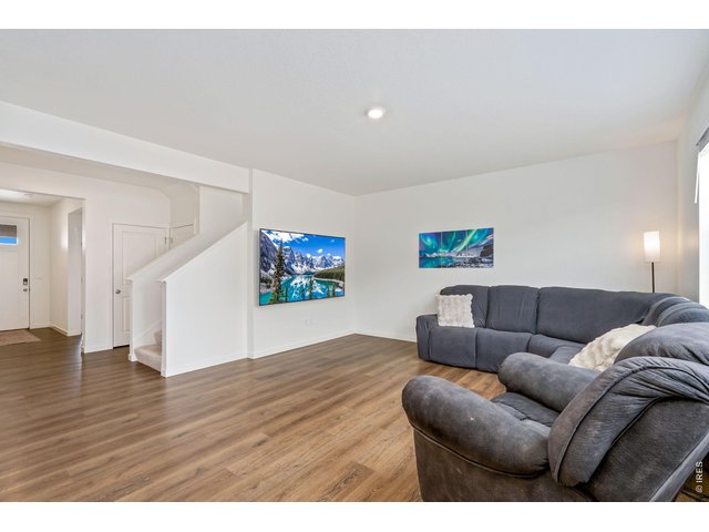 Property Photo 10 Step inside to an open, inviting floor plan where the expansive kitchen flows seamlessly into the dining area and main living space, perfect for entertaining!